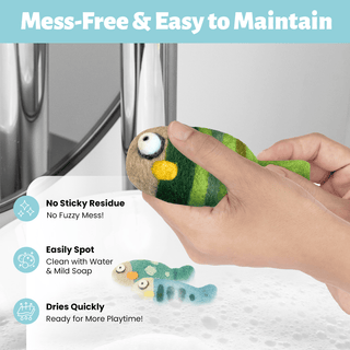 A person holds a Felted Fish Cat Toy over a soapy sink. Text reads: Mess-Free & Easy to Maintain—no sticky residue, easily spot cleaned, and dries quickly. Perfect eco-friendly cat toys!.