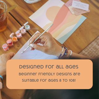 A person uses the Save the Bees Paint-by-Number Kit for Kids at a wooden table with paint pots, a brush, and colorful cards. Text on image reads: DESIGNED FOR ALL AGES. Encourages screen-free creativity for ages 8 to 108!.
