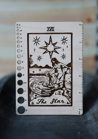The Maple Wood Tarot Card Knitting Needle Gauge & 5 Ruler features The Star tarot design with a woman pouring water, stars above, measurement circles on the left, and a 5 straight ruler on the right.