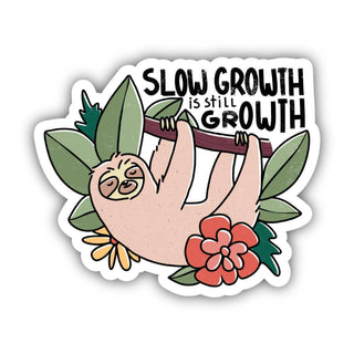 The Slow Growth Is Still Growth | Sloth Sticker features a cartoon sloth hanging from a branch with green leaves and colorful flowers, and the phrase "Slow growth is still growth." Made of waterproof vinyl—perfect for mental health awareness.
