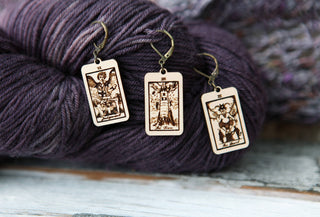Add mystical flair to your fiber arts with the 🔮 Tarot Card Stitch Markers– The Tower, The Devil & Judgement 🔮. These rectangular engraved markers double as earrings or knitting progress keepers—perfect for any project!.