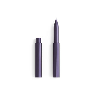 The Wren - Refillable Writing Pen in purple features an eco-friendly, geometric design. It stands upright with its cap beside it on a white background, and has a visible tip for easy, effortless writing.