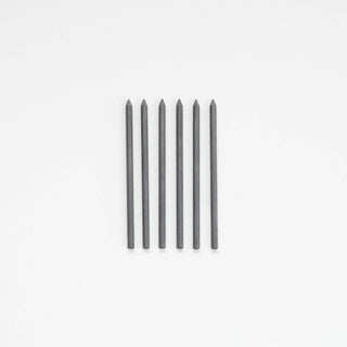 Six Replacement Pencil Leads for Flourish Pen are arranged vertically in a straight line, evenly spaced and parallel to each other on a plain white background.