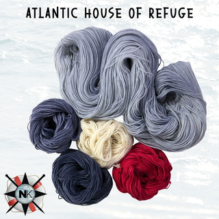 The Knitmas in July Knitting Kit 2026 features five skeins of gray, navy blue, red, and cream yarn on a light background—ideal for summer projects or a rectangle shawl. "Atlantic House of Refuge" with NK nautical logo tops the kit.