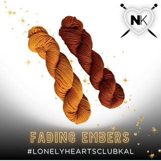 Two skeins of Lonely Hearts Club KAL Kit yarn in the Fading Embers colorway—warm orange and brown—rest on a white and black gradient with gold sparkles. A heart-shaped NK logo is top right. Text: Fading Embers and #LonelyHeartsClubKAL.