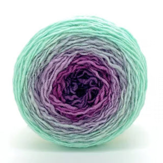 Freia Ombre & Gradient Sport Wool Yarn ball shown from the front against a white background, featuring mint green, lavender, and deep purple hues. Ideal for felting or creative knitting projects.
