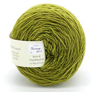 Freia Semi-Solid Sport Wool Yarn is a green, heavy sport weight yarn with a white label, made from 100% US wool.