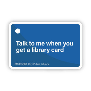 The "Talk to me when you get a library card | Sticker" is a blue vinyl sticker featuring the phrase, number 010065603, and City Public Library—perfect for any book lover's gift.