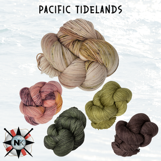 Five skeins of yarn in muted pastel to earthy tones are displayed on a pale background. At the top, the text reads Knitmas in July Knitting Kit 2026, ideal for crafting an Old Shale motif. A compass logo with NK appears in the lower left corner.
