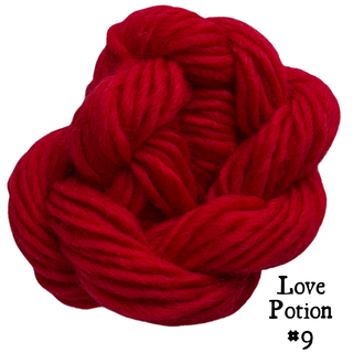 A ball of bright red yarn for the Tatters the Cat Poppet | Knitting Kit Love Potion #9 intention spell, with the title text displayed below.