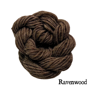 A small, round hank of dark brown yarn for the Tatters the Cat Poppet | Knitting Kit.