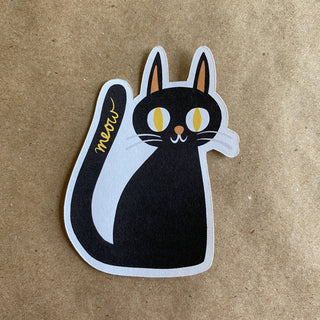 The Meow Cat sticker features a black cat with yellow eyes, white whiskers, and meow in yellow on its tail against a brown textured background—an eco-friendly choice for cat lovers.