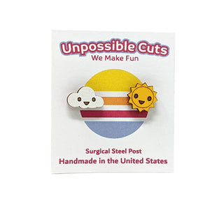 ☀️ Sun & Cloud Earrings ☁️—handmade wooden earrings shaped like a smiling sun and cloud, shown on a retro sunset card reading "Unpossible Cuts, We Make Fun, Surgical Steel Post, Handmade in the United States.