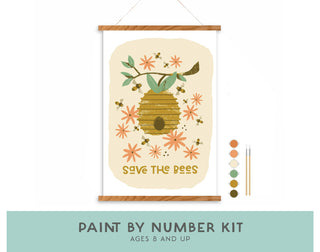 Save the Bees Paint-by-Number Kit for Kids: Features a beehive, bees, and orange flowers plus “SAVE THE BEES” text. Includes paints, two brushes, and a hanging frame. Banner: PAINT BY NUMBER KIT, AGES 8 AND UP.