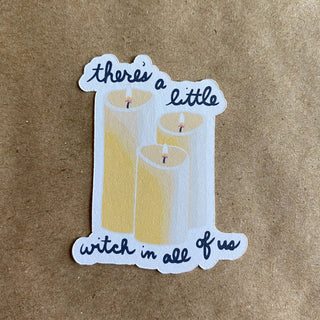 The There's A Little Witch In All Of Us sticker features three lit pillar candles on a brown background, surrounded by handwritten text. This charming Practical Magic sticker is printed on eco-friendly paper.