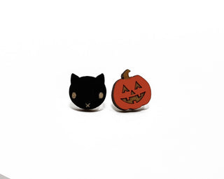 Add a spooky touch to your look with the 🐈‍⬛ Black Cat & Jack O’Lantern Earrings 🎃—featuring a black cat face with yellow eyes and an orange jack-o'-lantern, perfect for Halloween inspiration!.