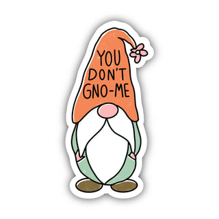 The You Don't Gno-Me Sticker is a waterproof vinyl decal showing a cartoon gnome in a green outfit and long orange hat with "YOU DONT GNO-ME" text, featuring a pink nose, white beard, brown shoes, and a white background.