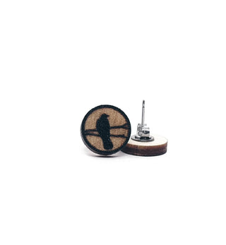 Crow Earrings: Handmade wooden earrings with a black crow silhouette on natural wood, featuring metal posts. Hypoallergenic design ensures stylish comfort for sensitive ears.