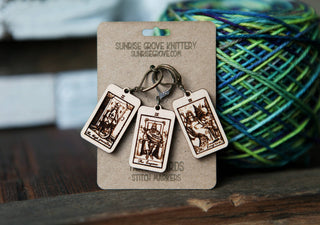 The Tarot Card Stitch Markers set features The High Priestess, The Empress & The Emperor designs engraved on maple wood, perfect as unique stitch markers or progress keepers for knitting or crochet. They come on a keyring and branded card.