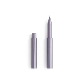 The Wren - Refillable Writing Pen in metallic purple stands vertically without its cap on a white background. The eco-friendly pen and cap are side by side, displaying the Japanese-made writing tip pointing upward.