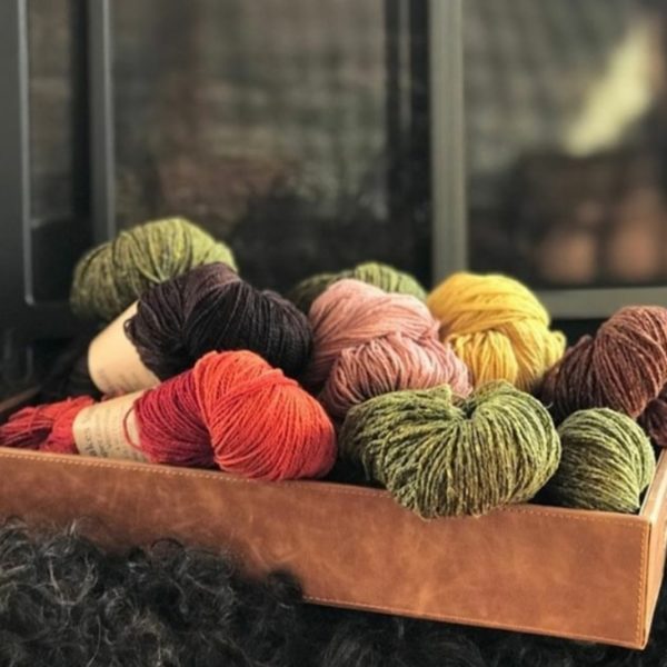 A pile of beautiful yarn in Nomadic Knits creative knitting magazine